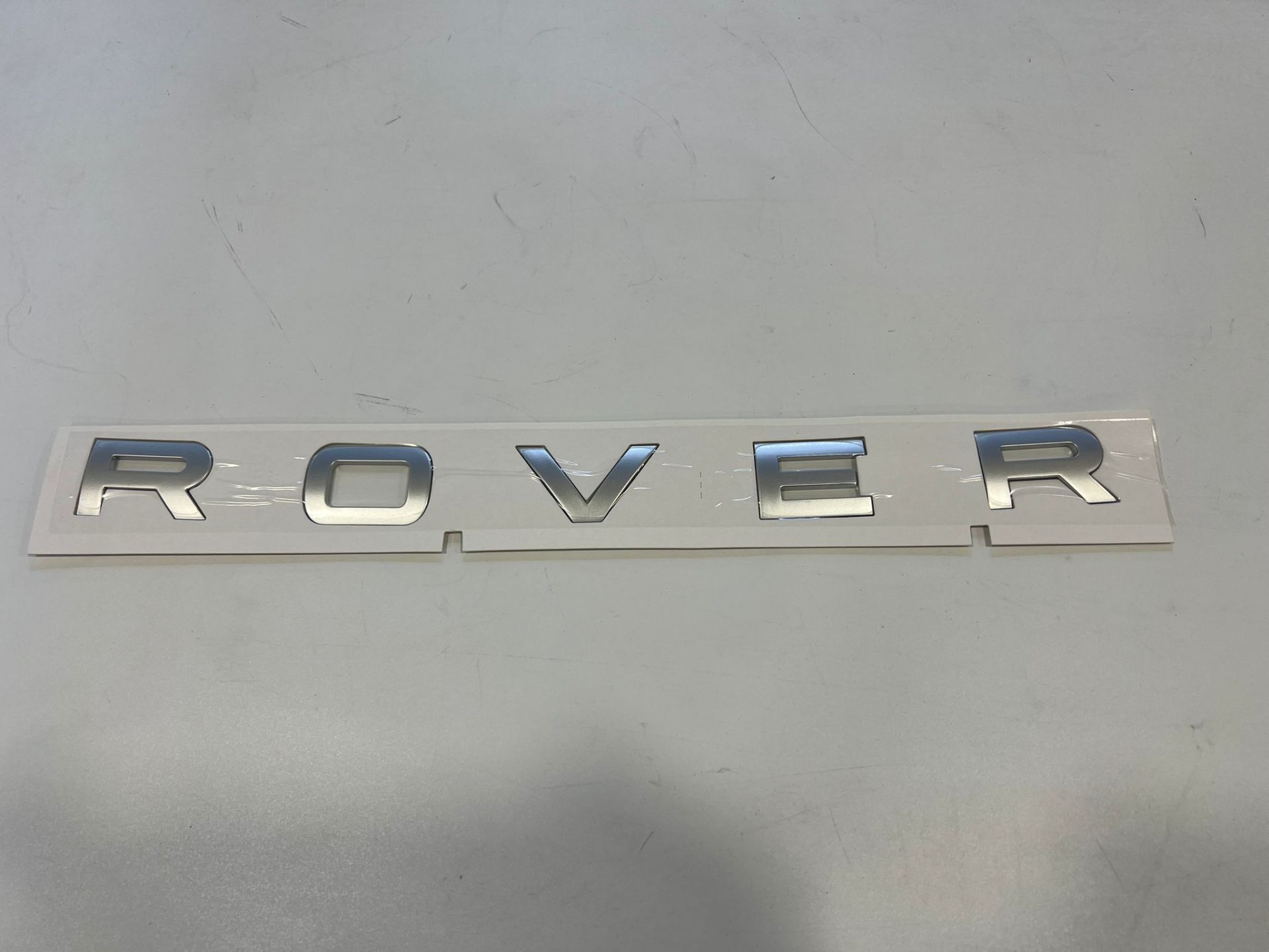 LR106492 Front Hood ROVER Text Range Rover