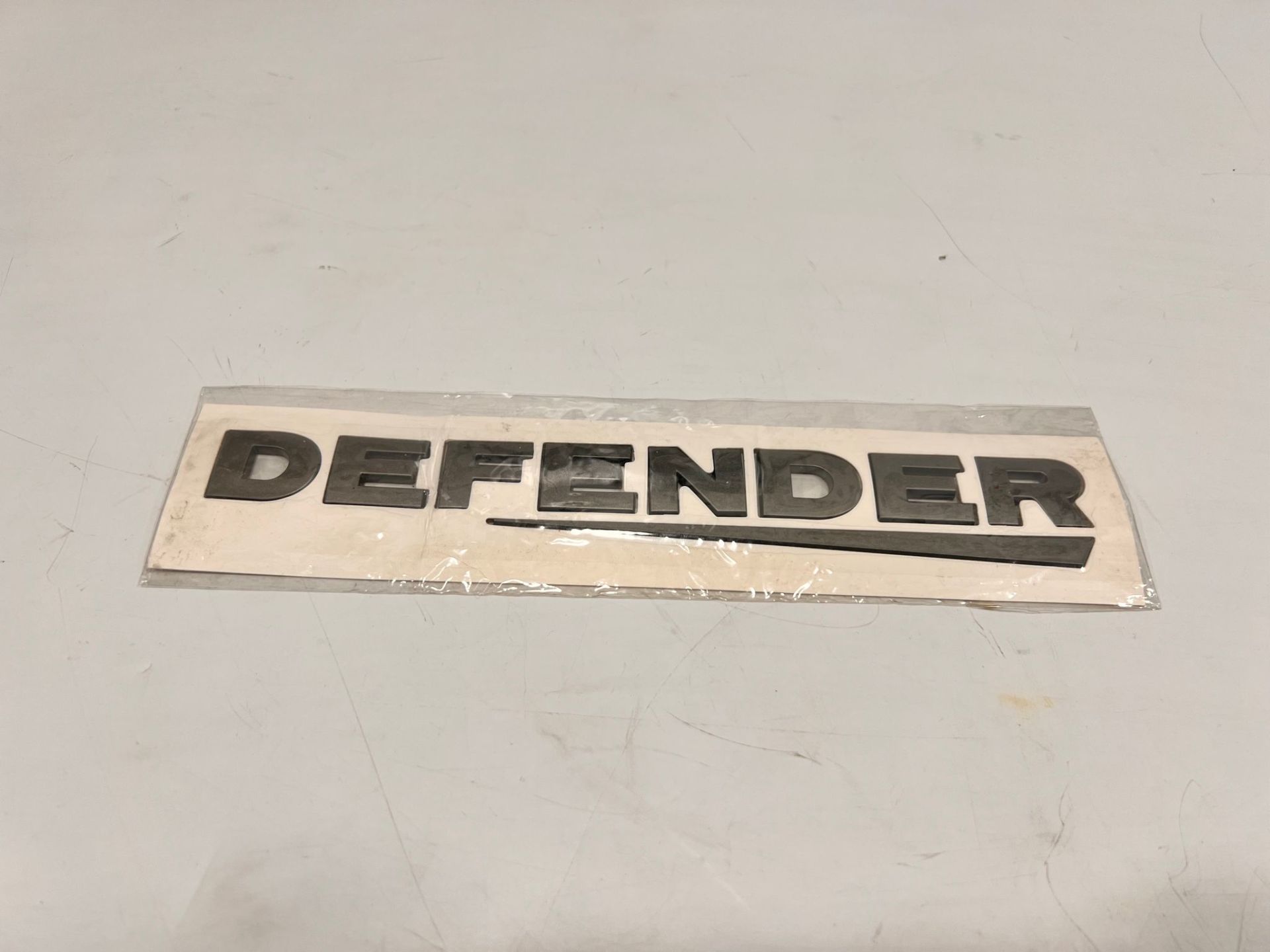 Defender Arka Yazı Koyu Gri